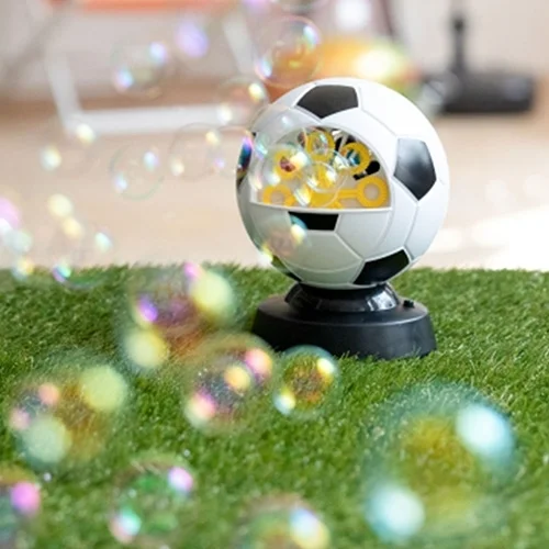 soccer ball, bubble machine, toy, grass, outdoor