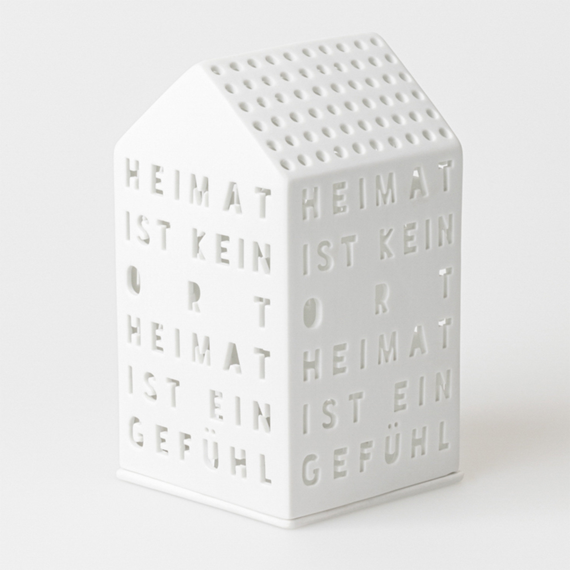 Räder Design - Lichthaus "Heimat ist kein Ort" Text