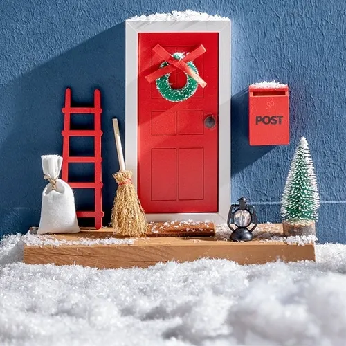red door, miniature scene, snow, post box, decorative door wreath